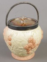 A Locke & Co Worcester ceramic biscuit barrel with metal lid and swing handle.