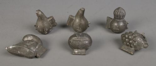 Six antique pewter ice cream moulds, including examples shaped as a Centurion's helmet, bulb and