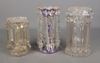 A collection of single lustre vases all varying colour and shape, one with blue and gilt design.