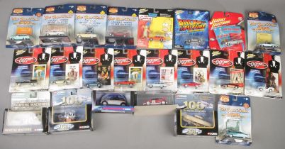 A quantity of boxed diecast vehicles. Includes Johnny Lightning 007, Simpsons, Back to the Future,