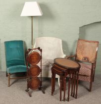 A small quantity of furniture. Includes nest of three tables, brass standard lamp, armchair with