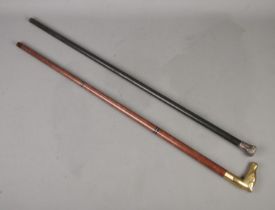 Two walking canes to include drinking/tipple example with brass horse head pommel and one white