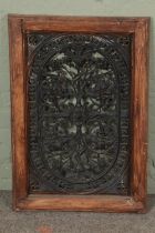 A large pierced cast iron plaque/vent within a wooden mount. Height: 85cm, Width: 59cm.