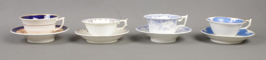 Four Rockingham cup and saucer sets. Includes 653 pattern with red griffin mark and blue and gilt