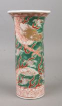 A mid 20th century Chinese sleeve vase decorated in coloured enamels with dragons. Height 18cm.