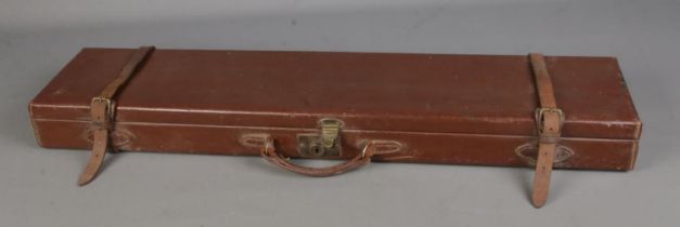 A Midland Gun Co gun case with fitted red interior. 83cm long