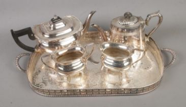 A collection of silver plate tea wares to include Viners of Sheffield three part service with tray