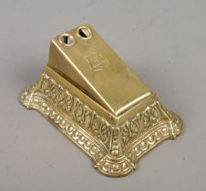 An early 20th century brass desk top cigar cutter. Marked 'Made In London' to top.