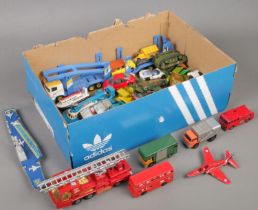 A box of diecast vehicles. Includes Corgi, Matchbox, etc.