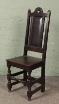 A late 18th/early 19th century oak chair of jointed construction. Height of back 111cm.