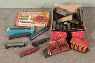 A box of assorted OO gauge model railway locomotives and carriages to include Hornby, Airfix,