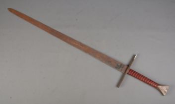 A broad sword with leather and wire wrapped grip. Length of blade 97cm. CANNOT POST OVERSEAS Heavily