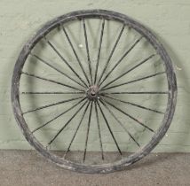 A cast iron cart wheel with original rubber edging Diameter 95cm