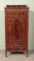 A carved mahogany cabinet with drawer base. (131cm x 60cm x 44cm)