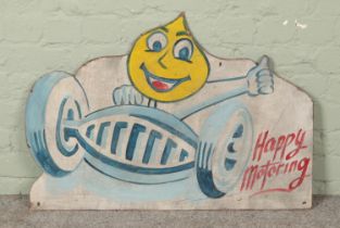 A vintage painted wooden board advertising Esso, 'Happy Motoring'. 60cm x 86cm.