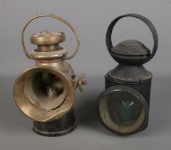 A Lucas King of the Road 722 oil lamp together with a similar railway lamp.