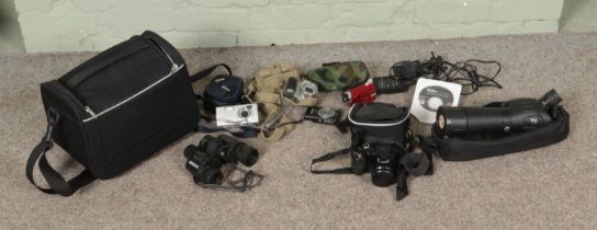 A collection of cameras to include Samsung, Canon and Vivitar along with Optus Monocular and