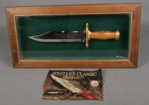 The John Wayne Commemorative Bowie Knife in display case. Length of blade 15.5cm. CANNOT POST