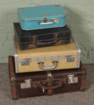 Four vintage suitcases, including wooden bound example stamped 22595383 CFN Nicholson and