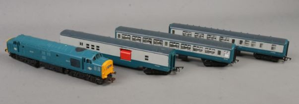A collection of OO gauge Tri-ang locomotives and carriages including a D6830, M14052, M30224and