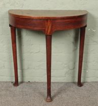 A Georgian mahogany demi lune side table.