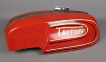 A Triton motorcycle fuel tank, with chromed cap.
