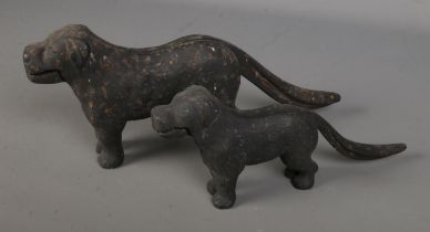 Two novelty cast iron nut crackers in the form of dogs.