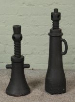 A pair of cast iron screw jacks.