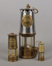 An Eccles Type 6 miners lamp along with two miniature mining lamps inscribed Sir Humphry Davy,