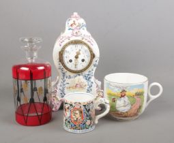A collection of ceramics and glass. Includes Longwy mantel clock, Laura Knight coronation cup, Tykes