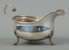 A George V silver sauceboat, raised on three paw feet. Assayed for Sheffield, 1932 by Cooper