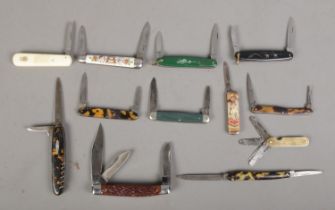 Twelve pocket knives. Includes commemorative, motor gauge, Solar, Wingfield, etc. CANNOT POST