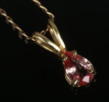 A 9ct gold padparadscha sapphire pendant on chain. Total weight 1.6g.