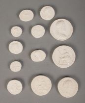 A collection of museum plaster casts of mostly Roman coins. Includes early Britannia examples.