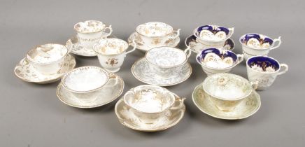 A collection of 19th century Rockingham porcelain teawares. All bearing puce griffin mark.