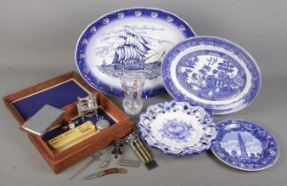 A box of miscellaneous. Includes blue and white ceramics, carved wooden box with collectables;