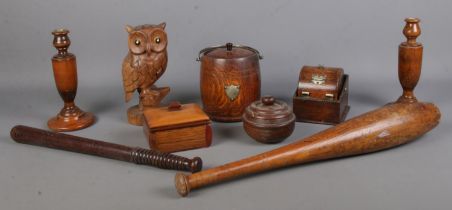 A quantity of woodenwares, to include barrel cigarette dispenser, a pair of turned candlesticks,