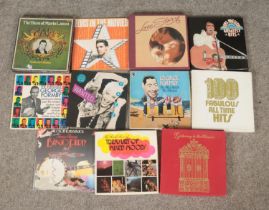 A collection of records including Elvis Presley Greatest Hits, Elvis In The Movies, The Best Of