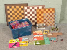 A box of assorted toys and games to include large quantity of unopened playing cards, several