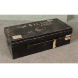 A military Royal Army Medical Core black painted tin trunk stenciled for Capt. R. Li. Lyon (R.A.M.C)