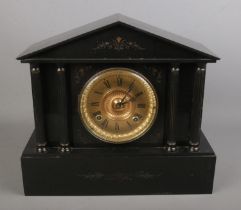 A slate 8 day mantel clock with gilt dial. (33cm x 37cm)