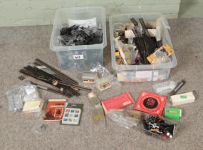 Two boxes of assorted model railway spares, repairs and accessories to include locomotive engines,