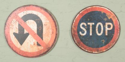 Two metal road signs. Includes STOP and No U-Turns.