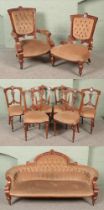 An Edwardian inlaid mahogany and walnut parlour suite.