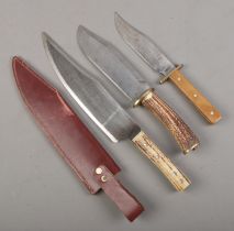 Three knives. Includes horn handle bowie knife example, etc. CANNOT POST OVERSEAS.