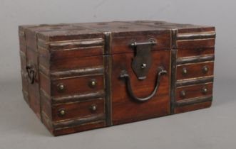 A small Eastern style metal bound wooden chest with hinged top. Height: 20cm, Width: 40cm, Depth: