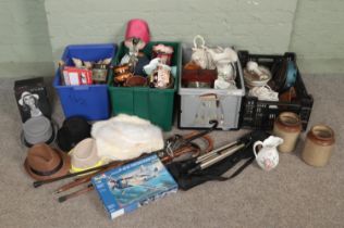 Four boxes of miscellaneous. Includes walking sticks with white metal mounts, wall clock, hats,