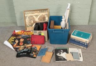Two boxes of miscellaneous to include character modelling guides, reproduction posters, framed