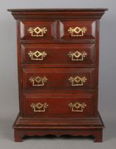 A miniature chest of drawers with brass handles. Hx56cm Wx40cm Dx20cm some handles loose missing