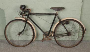 A vintage Raleigh Sports Model bicycle.